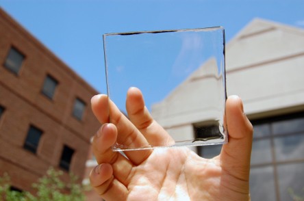 Solar power with a view: MSU doctoral student Yimu Zhao holds up a transparent luminescent solar concentrator module. Credit: Yimu Zhao via Sciencedaily.com